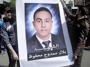 On March 24, Egyptians hold a poster with a photo of Belal Mamdouh, a teenager who was killed during clashes between soccer fans and Egyptian soldiers following the ban of the Port Said soccer team. On March 24, Egyptians hold a poster with a photo of Belal Mamdouh, a teenager who was killed during clashes between soccer fans and Egyptian soldiers following the ban of the Port Said soccer team.