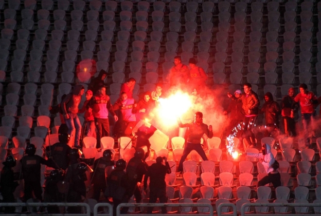 Egyptian soccer fans clash with riot police following a match between the hometown Al-Masry team and Cairo's Al-Ahly at the soccer stadium in Port Said, Egypt, on Feb. 1. Egyptian soccer fans clash with riot police following a match between the hometown Al-Masry team and Cairo's Al-Ahly at the soccer stadium in Port Said, Egypt, on Feb. 1.