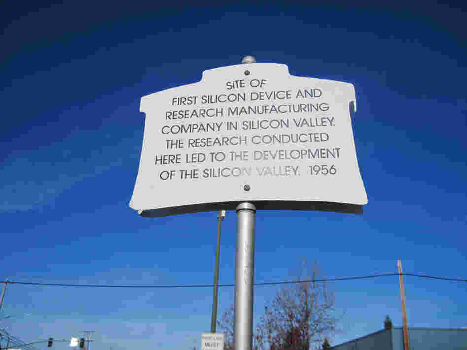 A plaque commemorating where Shockley set up in a lab in 1956. Shockley wanted to make better silicon-based transistors, but soon abandoned the pursuit. The building now houses an international produce market. A plaque commemorating where Shockley set up in a lab in 1956. Shockley wanted to make better silicon-based transistors, but soon abandoned the pursuit. The building now houses an international produce market.