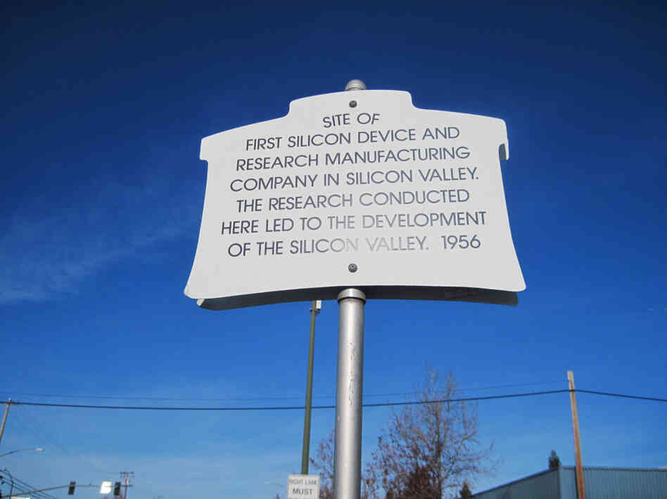 A plaque commemorating where Shockley set up in a lab in 1956. Shockley wanted to make better silicon-based transistors, but soon abandoned the pursuit. The building now houses an international produce market. A plaque commemorating where Shockley set up in a lab in 1956. Shockley wanted to make better silicon-based transistors, but soon abandoned the pursuit. The building now houses an international produce market.