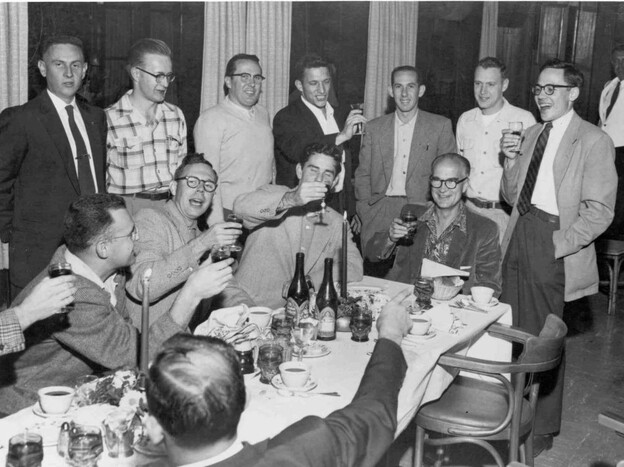 William Shockley (at head of table) celebrates winning a share of the 1956 Nobel Prize. Gordon Moore (seated far left), Sheldon Roberts (next to Moore), Robert Noyce (middle standing), and Jay Last (far right) are half of the "Traitorous Eight." 