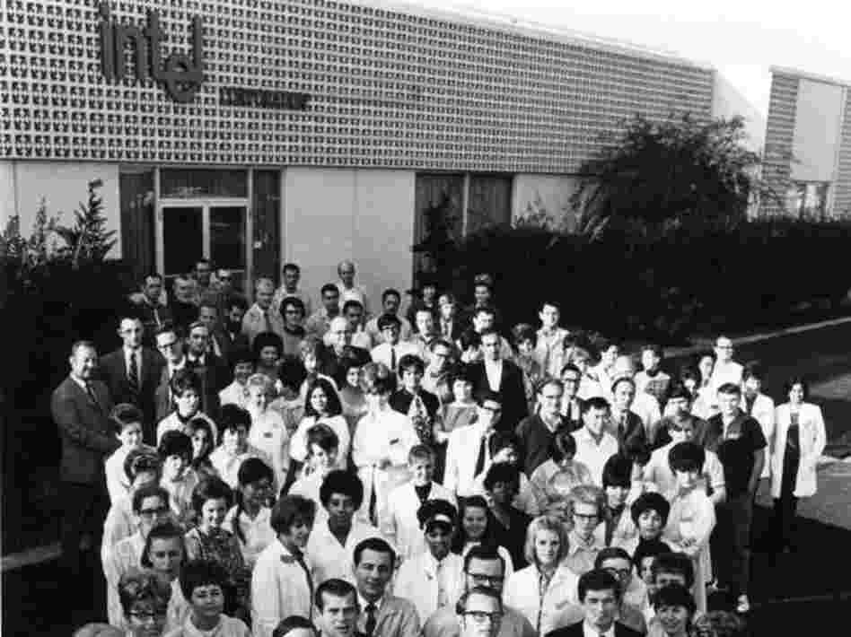 Intel's staff of just over 100 employees outside their first building in Mountain View, in 1969. Front left, co-founder Robert Noyce; front right, co-founder Gordon Moore. 