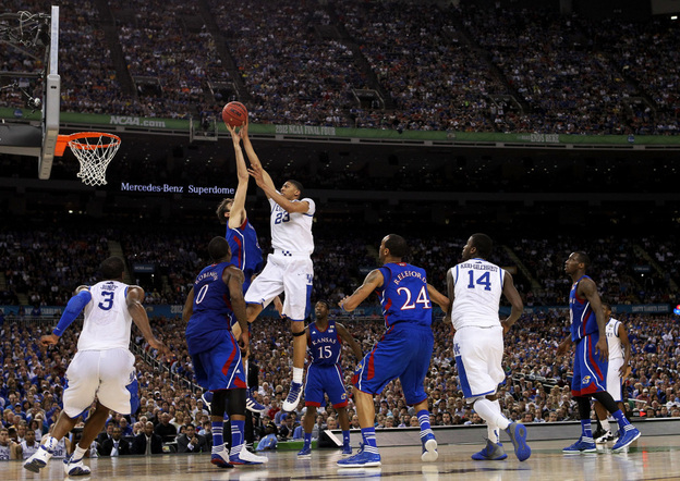 Anthony Davis of the Kentucky Wildcats puts up a shot over Jeff Withey of the Kansas Jayhawks in the NCAA Division I men's basketball final Monday night at the Mercedes-Benz Superdome in New Orleans.