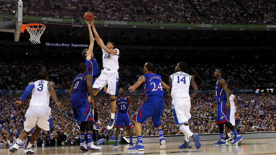 Anthony Davis of the Kentucky Wildcats puts up a shot over Jeff Withey of the Kansas Jayhawks in the NCAA Division I men's basketball final Monday night at the Mercedes-Benz Superdome in New Orleans.
