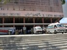 Ambulances are parked outside the Mogadishu National Theatre on Wednesday after a suicide attack in the Somali capital. A young woman strapped with explosives blew herself up on at a ceremony in the Somali national theater attended by the prime minister and other officials. Ambulances are parked outside the Mogadishu National Theatre on Wednesday after a suicide attack in the Somali capital. A young woman strapped with explosives blew herself up on at a ceremony in the Somali national theater attended by the prime minister and other officials.