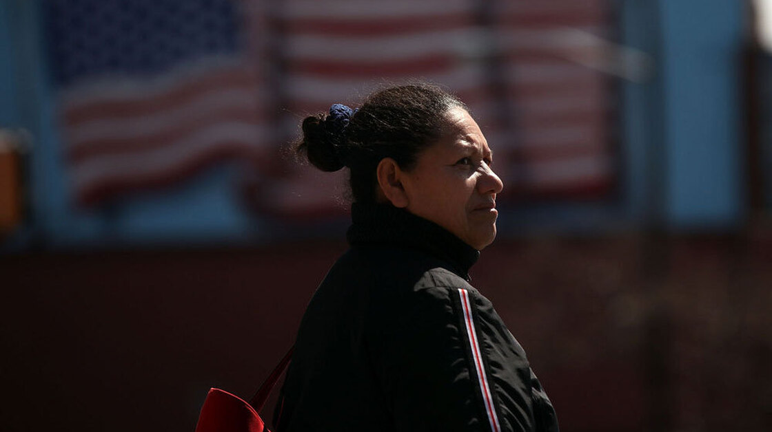  A Hispanic woman walks down a street in Union City, N.J. In a new study, the Pew Hispanic Center asked Hispanic-Americans how they identify themselves. 