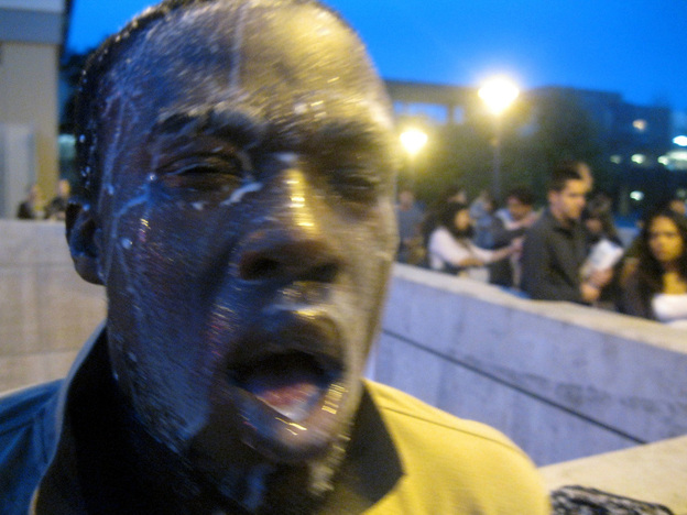 Nnaemeka Alozie, campaign manager for California congressional candidate David Steinman, poured milk on his face Tuesday after being pepper sprayed during the incident at Santa Monica College. 