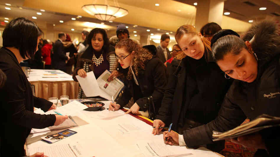 Job seekers attend a career fair in New York City. Federal Reserve Chairman Ben Bernanke says the quick drop in unemployment might have been a reversal of overzealous cutbacks during the financial crisis.