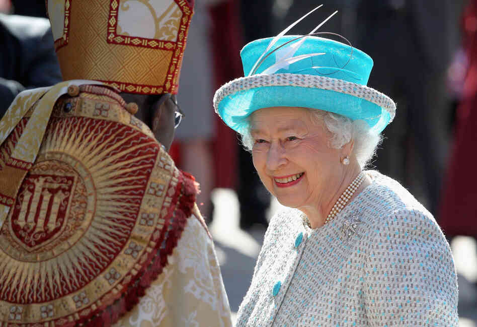 Queen Elizabeth II smiles as she greets Archbishop of York John Sentamu as she arrives for Maundy Thursday Service at York Minster on April 5, 2012 in York, England.