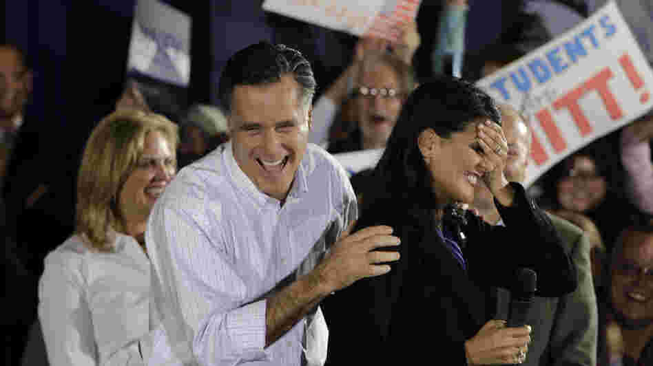 Mitt Romney laughs with South Carolina Gov. Nikki Haley (right) during a campaign event in Greenville, S.C., on Jan. 20. Haley says Ann Romney (left) will be important in helping the former Massachusetts governor appeal to female voters.