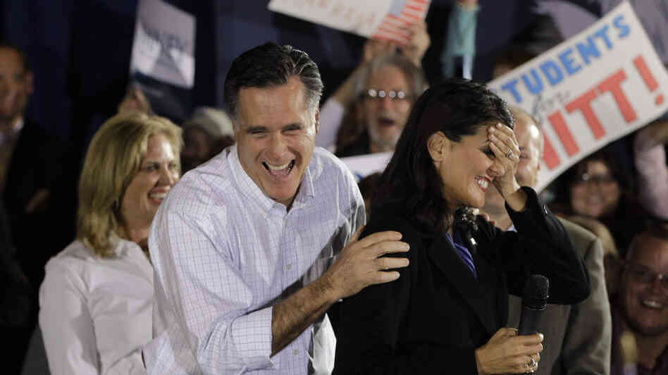 Mitt Romney laughs with South Carolina Gov. Nikki Haley (right) during a campaign event in Greenville, S.C., on Jan. 20. Haley says Ann Romney (left) will be important in helping the former Massachusetts governor appeal to female voters.