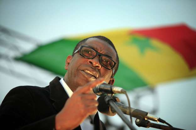 Youssou N'dour speaks during a united opposition rally in February.
