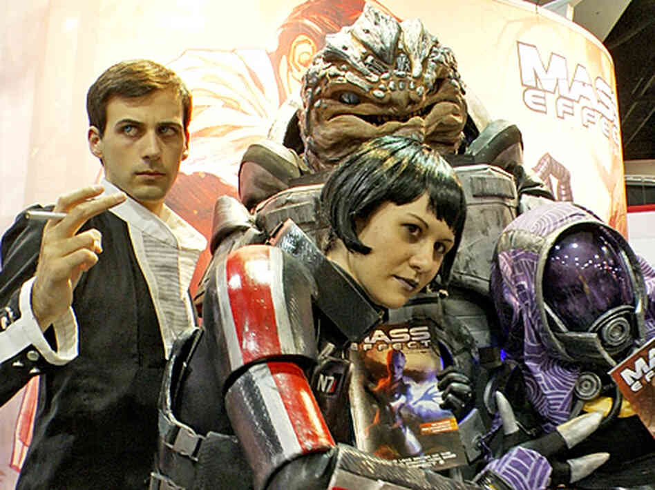 Costume designer Holly Conrad (center) poses with some of her own creations inspired by the popular video game Mass Effect. Costume designer Holly Conrad (center) poses with some of her own creations inspired by the popular video game Mass Effect.