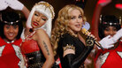 Nicki Minaj (left) and Madonna perform during the halftime show at the Super Bowl in February. In a song from Madonna's new album, MDNA, the two singers each play with traditionally feminine and masculine gender roles. Nicki Minaj (left) and Madonna perform during the halftime show at the Super Bowl in February. In a song from Madonna's new album, MDNA, the two singers each play with traditionally feminine and masculine gender roles.