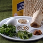 The Passover Seder plate with symbolic foods (clockwise, from top center): horseradish; a shank bone; a mixture of fruit, wine and nuts called haroset; lettuce, parsley and an egg. The Passover Seder plate with symbolic foods (clockwise, from top center): horseradish; a shank bone; a mixture of fruit, wine and nuts called haroset; lettuce, parsley and an egg.