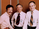 Intel's first hire (from left), Andy Grove, and Intel co-founders Robert Noyce and Gordon Moore in 1978, the 10th anniversary of the company. Grove is sitting on a graphical layout (a rubylith) of one of Intel's early microprocessors. Intel's first hire (from left), Andy Grove, and Intel co-founders Robert Noyce and Gordon Moore in 1978, the 10th anniversary of the company. Grove is sitting on a graphical layout (a rubylith) of one of Intel's early microprocessors.