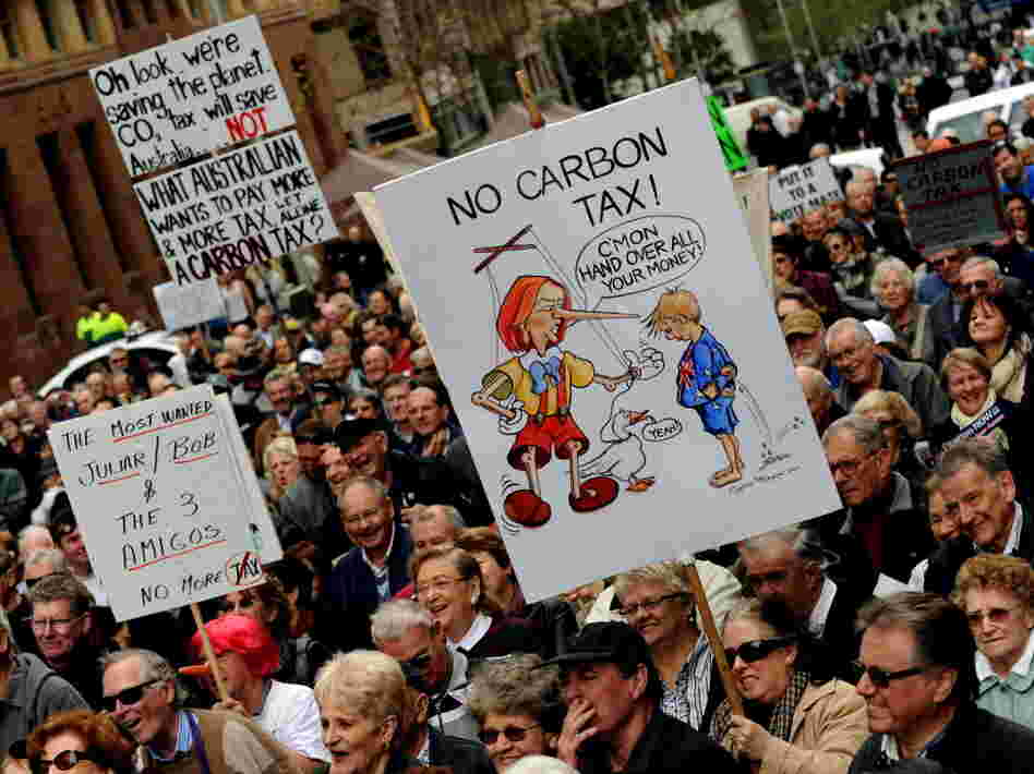 Protesters rally in Sydney last July against Australian Prime Minister Julia Gillard's planned carbon tax.