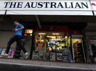 A jogger runs past a banner for The Australian, part of Rupert Murdoch's newspaper empire, in Sydney last year. A jogger runs past a banner for The Australian, part of Rupert Murdoch's newspaper empire, in Sydney last year.