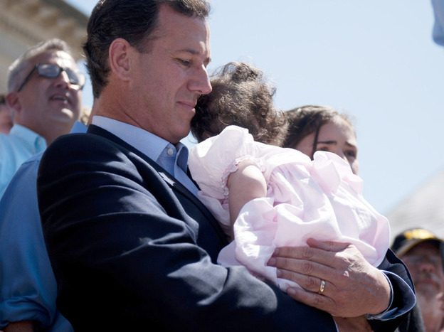Rick Santorum holds his youngest child, Isabella, before announcing his run for the presidency on June 6 in Somerset, Pa. Santorum's campaign announced Friday that Isabella, who was born with trisomy 18, had returned to the hospital.