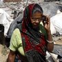 A woman talks on her cellphone in a slum area of Bhopal last month.