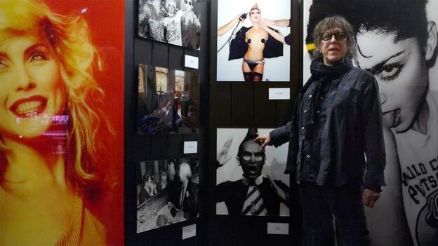 Mick Rock gives a tour of his photographs at the opening of his traveling show, Rocked, at the W Hotel in Washington, D.C. 