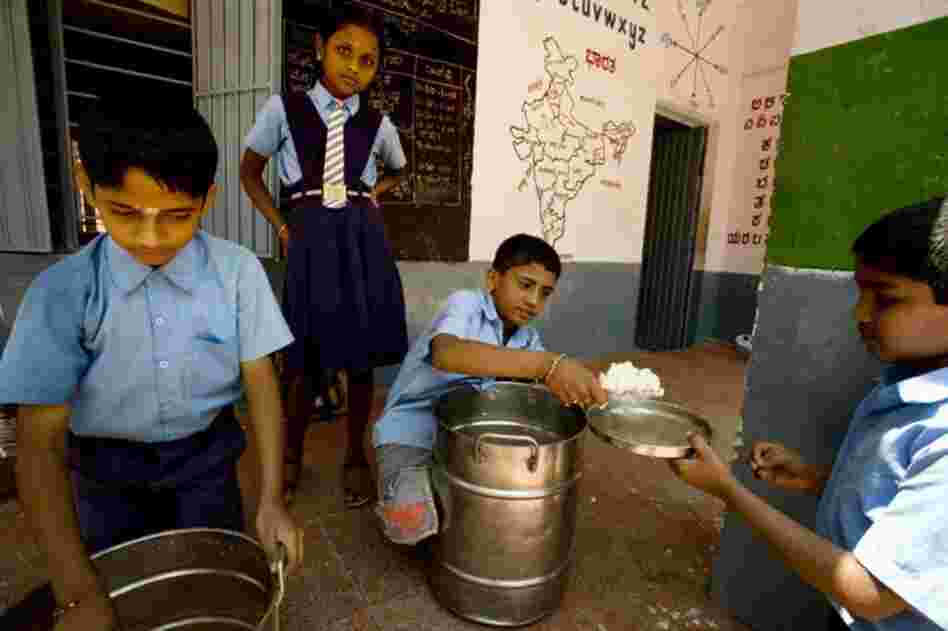 The school lunch program customizes the menu in different parts of the country to local preferences. At this middle school in Bangalore, lunch often consists of a South Indian meal of rice and vegetable-lentil soup.