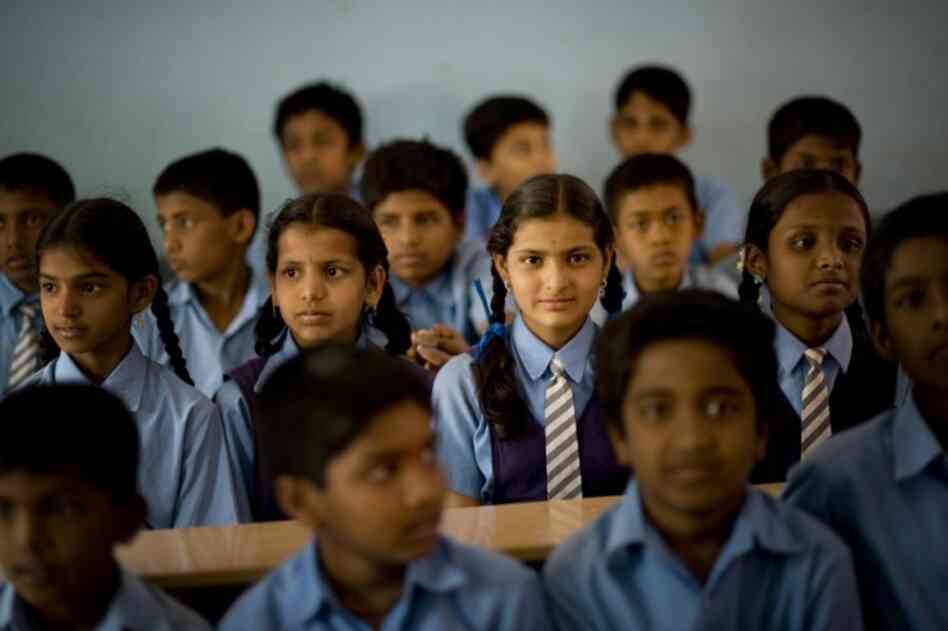 Many malnourished students have benefitted from the Akshaya Patra school lunch program. Bangalore middle school student K. Suchitra (center), 13, often comes to school with an empty stomach, but she knows she'll eat at school and can have as many servings as she wants.