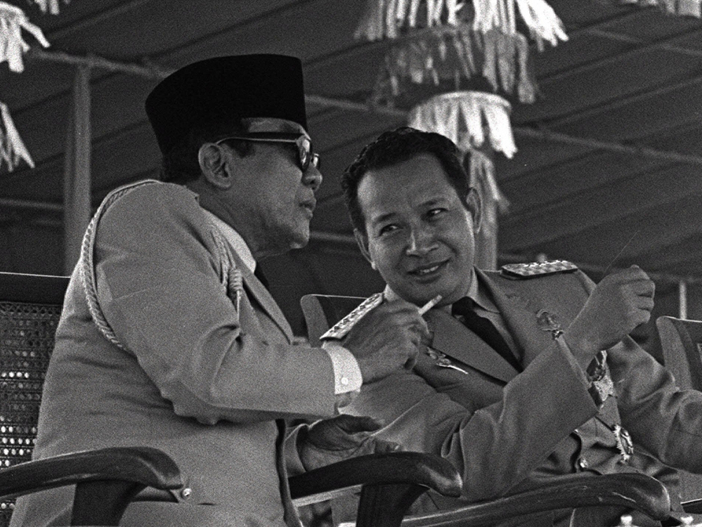 Indonesian President Sukarno (left) surrenders his executive powers to Gen. Suharto, Feb. 22, 1967, in Jakarta. Suharto led the anti-communist purge and ruled the country until 1998.