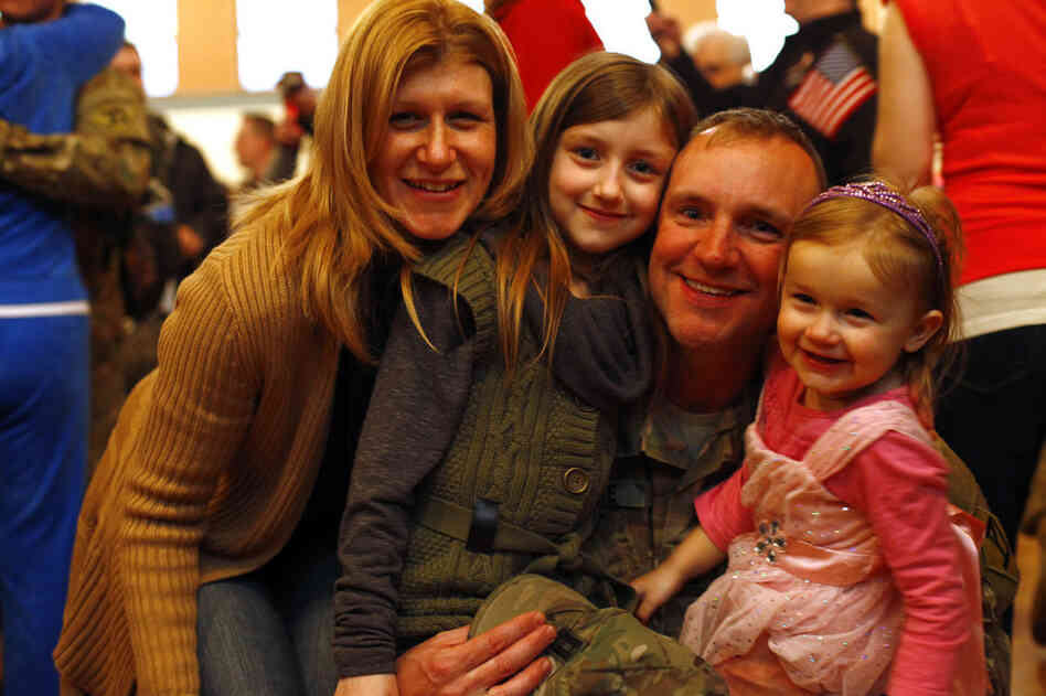 Michael Currie was stationed in Afghanistan for the past year, leaving behind his wife, Stacey, and daughters, Gracelyn and Isabella, 2.