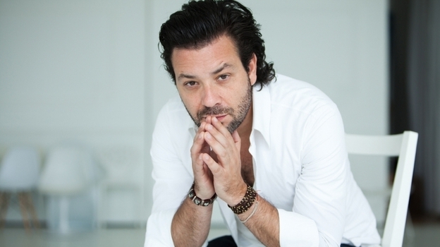 Adam Cohen says he's proud to be the son of singer Leonard Cohen.
