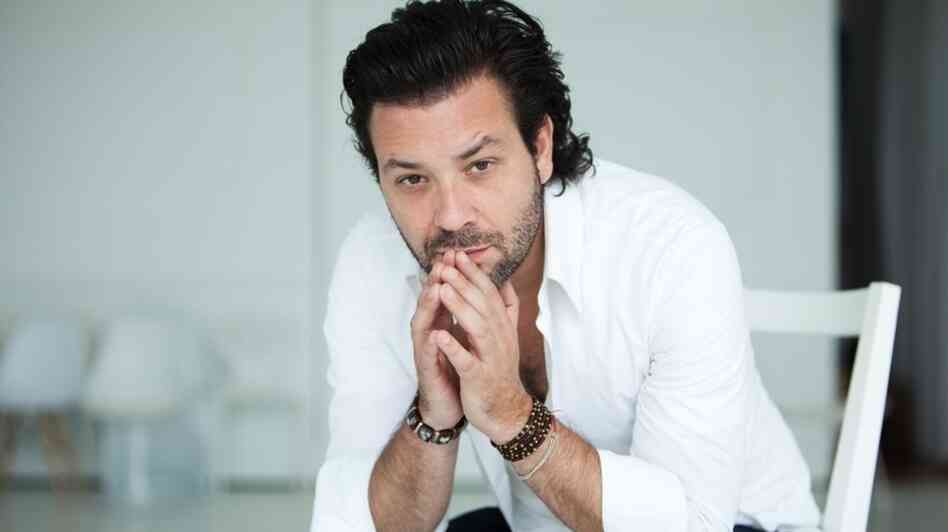 Adam Cohen says he's proud to be the son of singer Leonard Cohen.