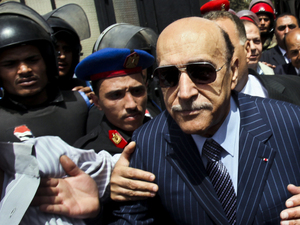 Omar Suleiman (right), who was intelligence chief and vice president under former Egyptian President Hosni Mubarak, leaves the presidential elections committee headquarters in Cairo on April 7, after submitting his candidacy papers. Omar Suleiman (right), who was intelligence chief and vice president under former Egyptian President Hosni Mubarak, leaves the presidential elections committee headquarters in Cairo on April 7, after submitting his candidacy papers.