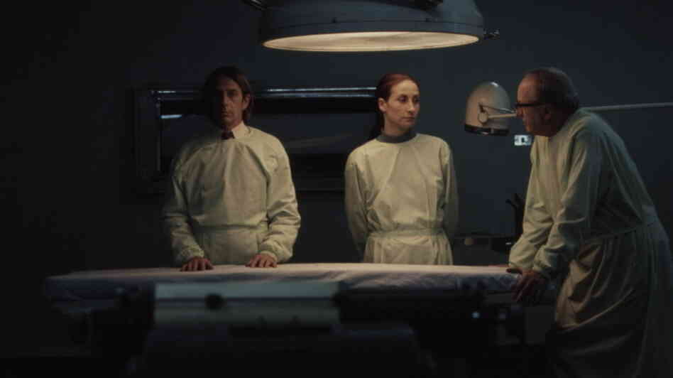 Set during the 1973 military coup that ousted Chile's president and installed Augusto Pinochet's dictatorship, Post Mortem follows Mario (Alfredo Castro, left), a transcription clerk at the hospital morgue where Dr. Castillo (Jaime Vadell, right) and his assistant Sandra (Amparo Noguera) perform autopsies. Set during the 1973 military coup that ousted Chile's president and installed Augusto Pinochet's dictatorship, Post Mortem follows Mario (Alfredo Castro, left), a transcription clerk at the hospital morgue where Dr. Castillo (Jaime Vadell, right) and his assistant Sandra (Amparo Noguera) perform autopsies.