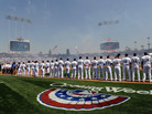 The L.A. Dodgers stand on the third baseline during the national anthem on opening day at Dodger Stadium. They beat the Pittsburgh Pirates, 2-1, on Tuesday in Los Angeles. The L.A. Dodgers stand on the third baseline during the national anthem on opening day at Dodger Stadium. They beat the Pittsburgh Pirates, 2-1, on Tuesday in Los Angeles.