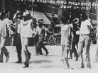 Black detainees are led to the Convention Hall following a race riot in Tulsa, Okla, June 1, 1921. The National Guard rounded up blacks by the thousands and took them to the fairgrounds, the Convention Hall and a baseball stadium where they were given food and water. By day's end, many thriving black businesses in a 35-block area had been torched. Black detainees are led to the Convention Hall following a race riot in Tulsa, Okla, June 1, 1921. The National Guard rounded up blacks by the thousands and took them to the fairgrounds, the Convention Hall and a baseball stadium where they were given food and water. By day's end, many thriving black businesses in a 35-block area had been torched.