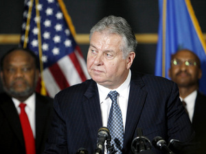 Tulsa Police Chief Chuck Jordan (center) speaks as City Councilor Jack Henderson (right) and FBI agent James Finchother listen during a news conference on Sunday in Tulsa, Okla. Tulsa Police Chief Chuck Jordan (center) speaks as City Councilor Jack Henderson (right) and FBI agent James Finchother listen during a news conference on Sunday in Tulsa, Okla.