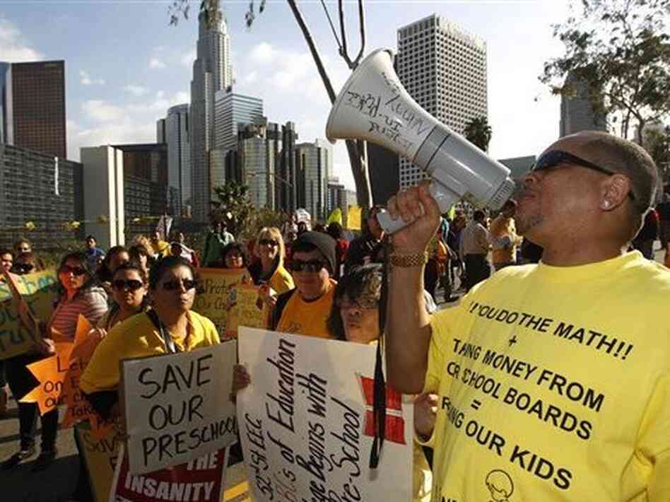 Some states are still struggling; California has lost 32,000 teaching positions since 2008. Here, teachers, parents and supporters rally as the Los Angeles Unified School District board meets to consider budget cuts and layoffs on Feb. 14. 