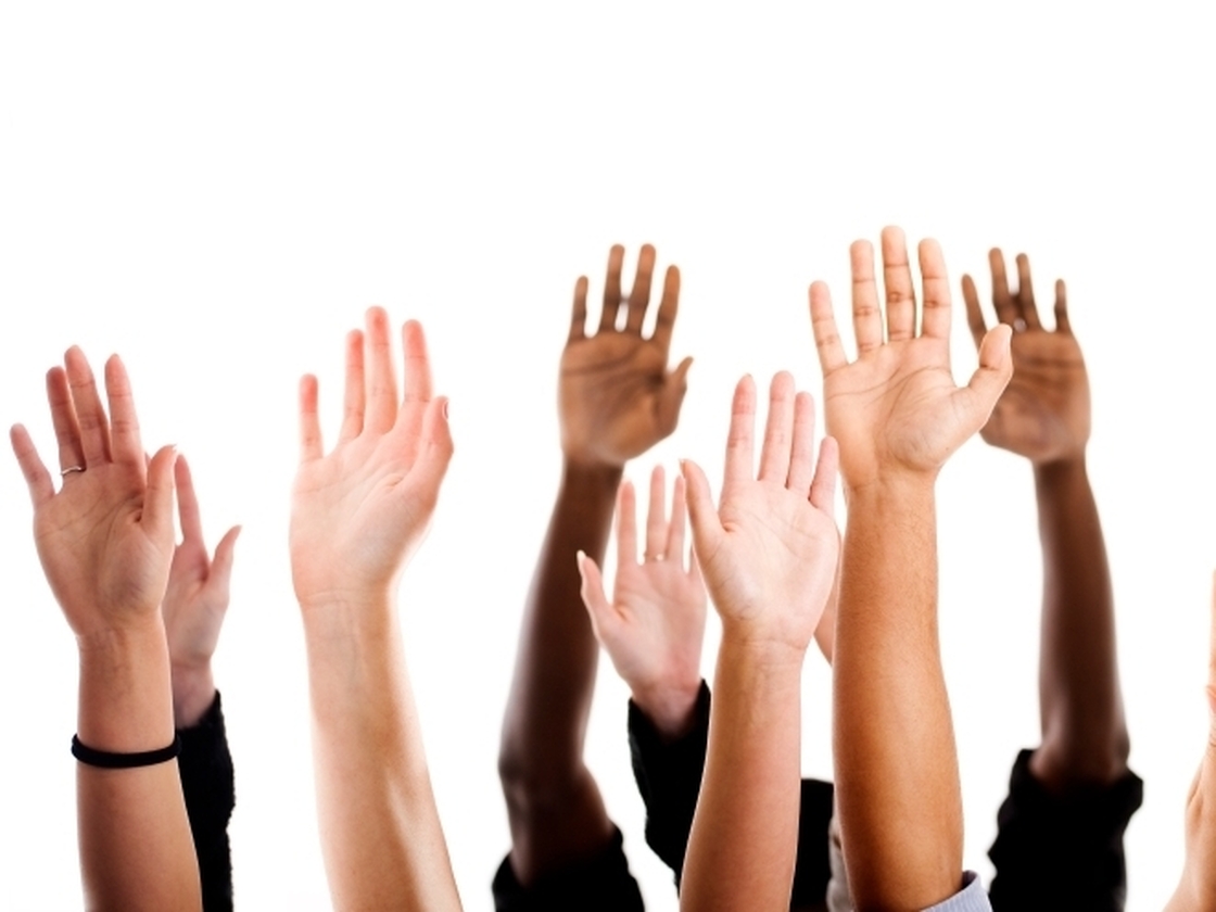 Raised hands variety of races.