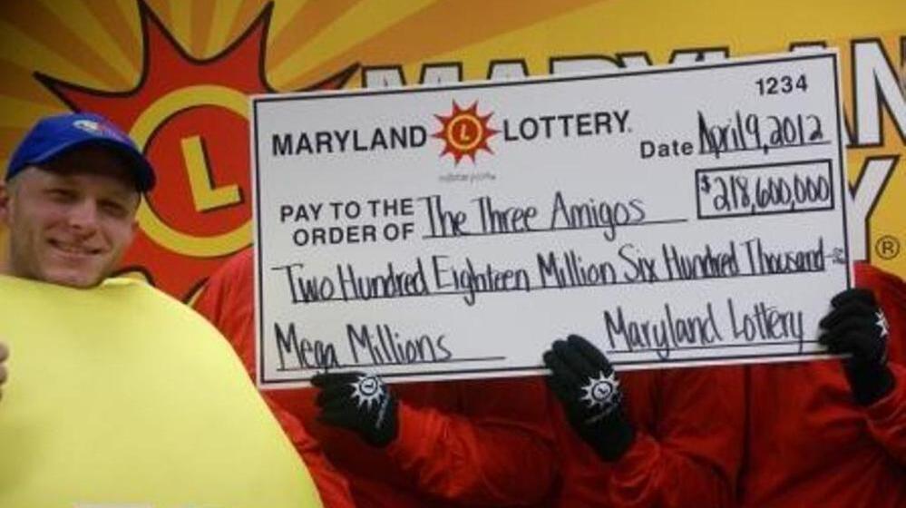 The three anonymous Mega Millions winners celebrate their $218.6 jackpot with a lotto friend. 
