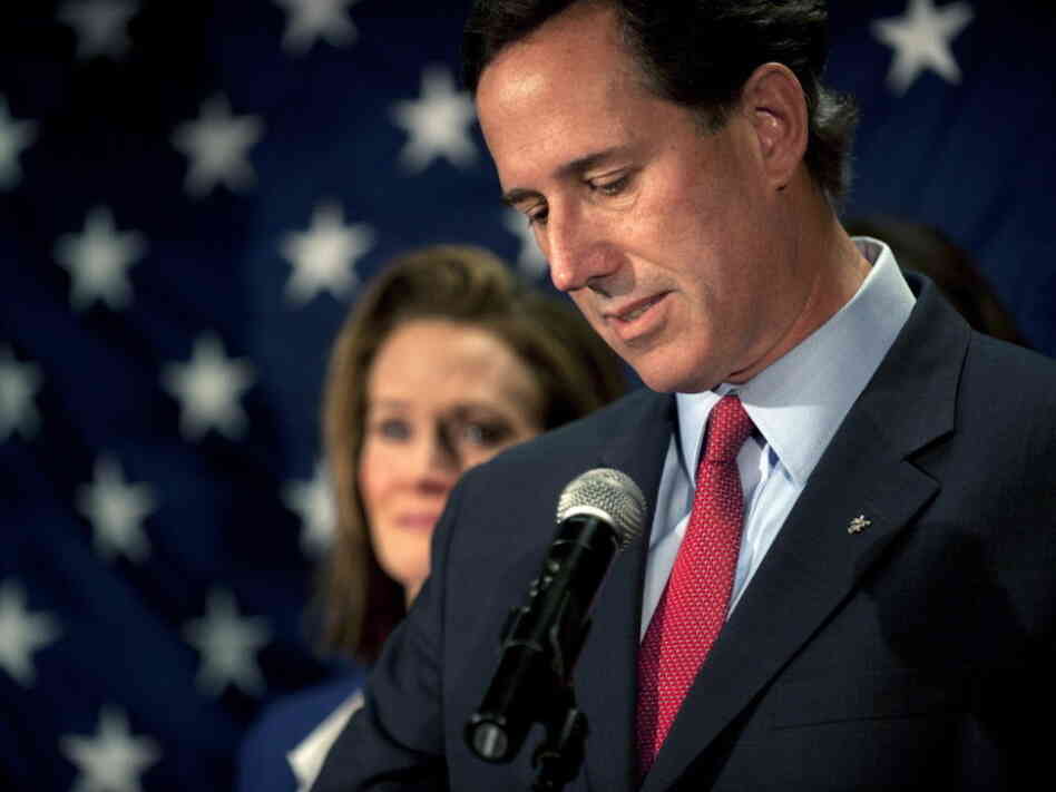 Former Sen. Rick Santorum as he announced the end of his White House bid. His wife, Karen, is in the background.