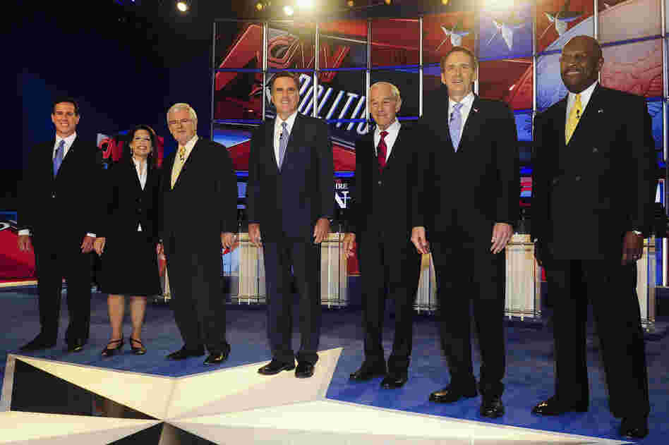Santorum joins the field of candidates on stage in Manchester, N.H., before a GOP presidential debate on June 13. 