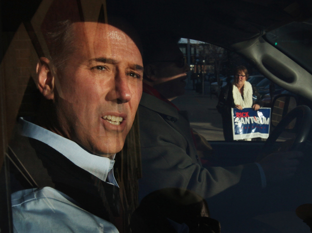 Santorum leaves a campaign stop at the Daily Grind coffee shop in Sioux City, Iowa, on Jan. 1.