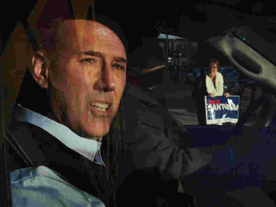 Santorum leaves a campaign stop at the Daily Grind coffee shop in Sioux City, Iowa, on Jan. 1.