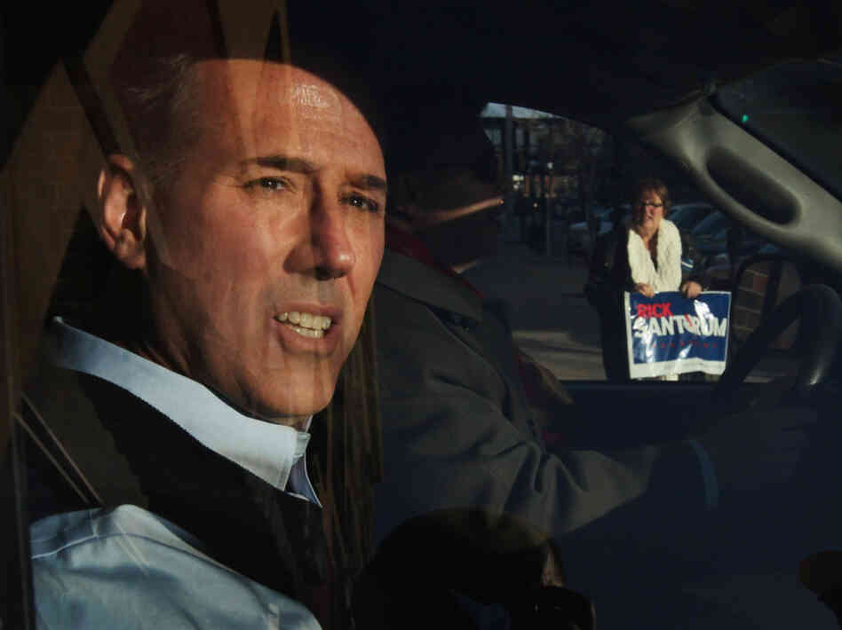 Santorum leaves a campaign stop at the Daily Grind coffee shop in Sioux City, Iowa, on Jan. 1.