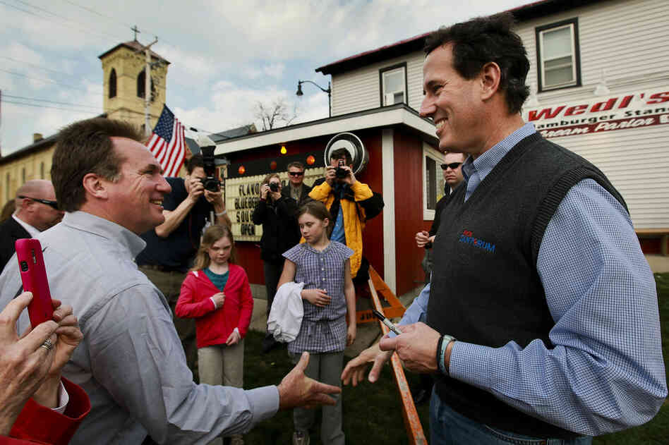 A week before Wisconsin's primary, Santorum chats with Mayor Dale Oppermann in Jefferson, Wis., on March 27. 