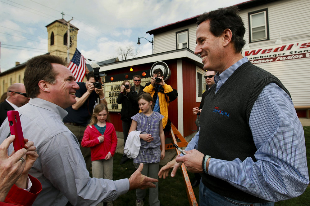 A week before Wisconsin's primary, Santorum chats with Mayor Dale Oppermann in Jefferson, Wis., on March 27. 