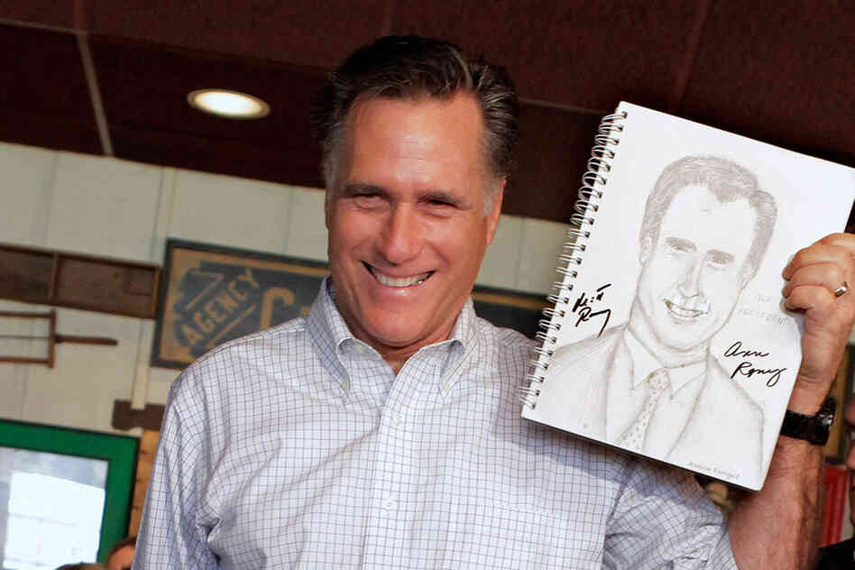 Spittin' Image: Romney holds up a sketch drawn by a supporter during a campaign stop in Rockford, Ill., in March. 