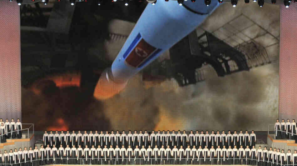 A concert in Pyongyang in February 2012 commemorates the birthday of North Korea's late leader, Kim Jong Il. The backdrop shows a North Korean rocket that was launched in April 2009 — and was followed a month later by a nuclear test.
