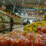  A woman looks over vegetables in Carulla Supermarket in Bogota, Colombia. The country, which plays host this weekend to the Summit of the Americas, is a rising star in the region. Foreign investment has quadrupled over the past decade, and it has a new free-trade agreement with the U.S.