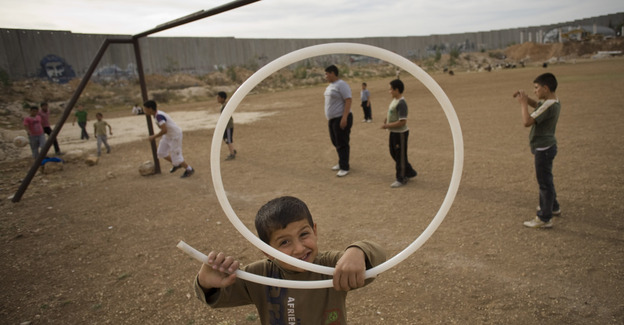 Palestinian children play next to Israel's separation barrier in the West Bank town of Abu Dis in 2011. As peace talks between Israel and Palestine remain at a standstill, people are looking to other possible solutions. Palestinian children play next to Israel's separation barrier in the West Bank town of Abu Dis in 2011. As peace talks between Israel and Palestine remain at a standstill, people are looking to other possible solutions.